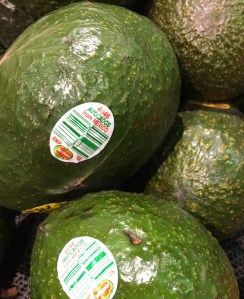 photo of avocados with stickers on them